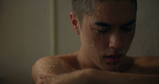 Young Man Reflecting While Taking a Shower - Download Free Stock Images Pikwizard.com