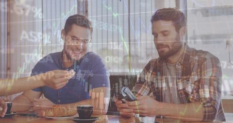 Men in Cafe Paying with Card Amid Financial Market Digital Overlay