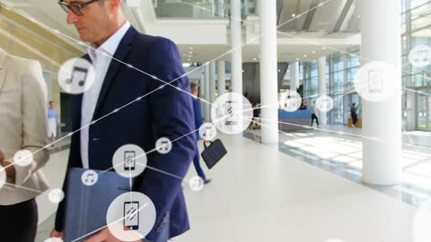 Colleagues Discussing Reports with Digital Connectivity Overlay