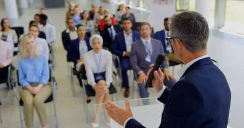 Speaker Leading Business Seminar to Diverse Audience - Download Free Stock Images Pikwizard.com