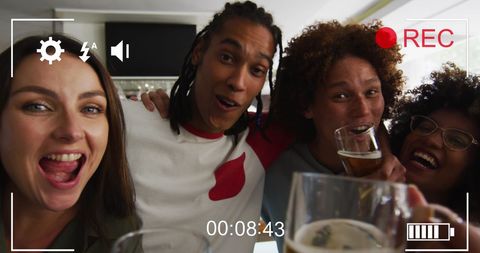 Diverse Friends Celebrating Together in Bar Setting