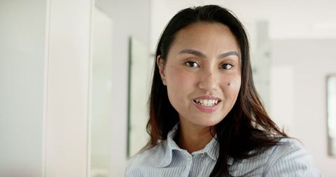 Professional Asian Woman in Modern Office Environment