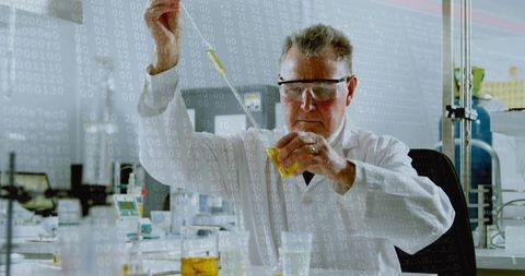 Senior scientist pipetting yellow reagent in lab with data overlay and glassware