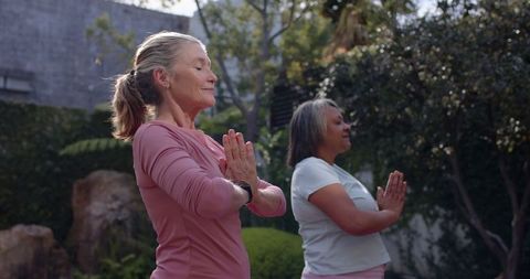 Diverse Women Practicing Yoga Outdoors Embracing Serenity