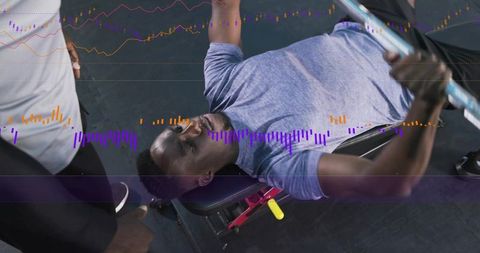 Athlete bench pressing on adjustable bench with spotter and digital performance overlay