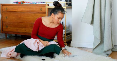 Fashion Designer Working on Tablet in Cozy Studio