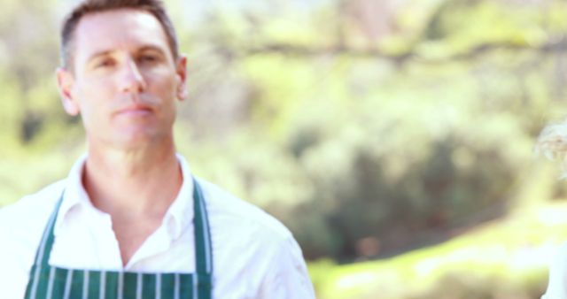 Blurred Chef in Striped Apron Outdoors - Download Free Stock Images Pikwizard.com