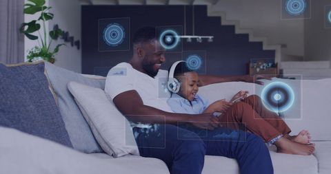 Father and Son Enjoy Time Together Using Tablet with Digital Interface - Download Free Stock Images Pikwizard.com