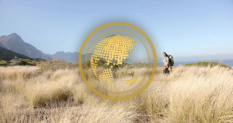 Hiker Exploring Scenic Coastal Landscape with Clear Blue Sky