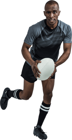 Determined sportsman running with rugby ball isolated on transparent background