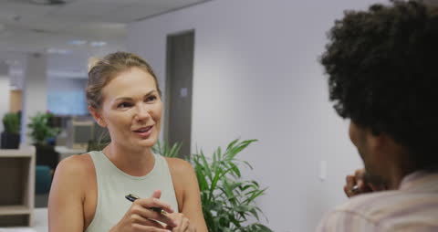 Business Colleagues Discussing Project in Modern Office Setting