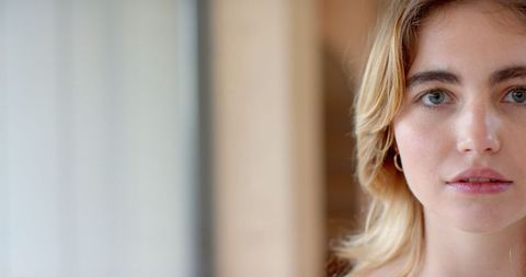 Woman Gazing in Natural Light with Subtle Expression