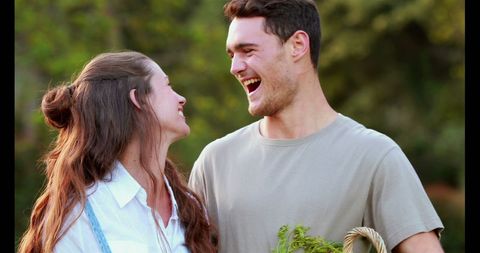 Couple Laughing Together Outdoors in Casual Attire, Embracing Joy - Download Free Stock Images Pikwizard.com