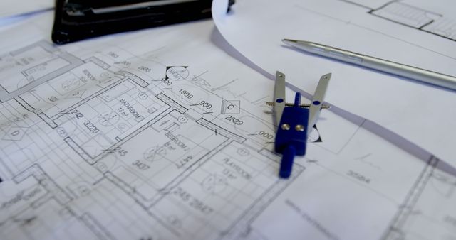 Architectural Blueprints with Compass and Pen on Desk - Download Free Stock Images Pikwizard.com