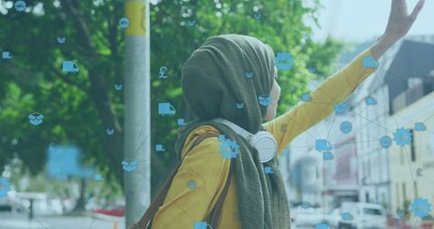 Person in Hijab Hailing Taxi, Digital Technology Overlay