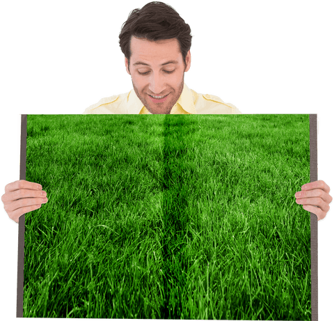 Caucasian guy holding green grass image on transparent background