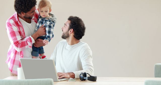 Family bonding moment during remote work setup - Download Free Stock Images Pikwizard.com