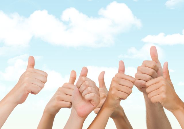 Several hands with thumbs up against a clear blue sky with wispy clouds. This image represents approval, success, and teamwork. Suitable for use in business presentations, motivational posters, and social media campaigns promoting positivity and collaboration.