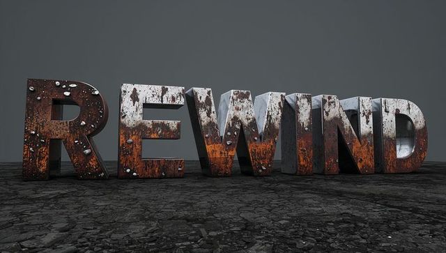 Rusted 3D REWIND Letters Standing on Cracked Industrial Ground with Weathered Patina