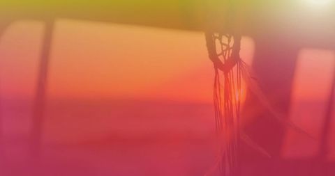 Dream catcher swirling with vivid sunlit background