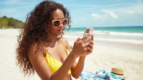 Woman Enjoying Beach While Using Smartphone