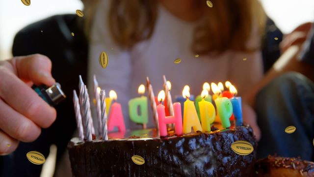 This depiction shows a woman lighting colorful candles on a birthday cake. Animated effects like falling balls and other decorative elements give a lively and festive atmosphere to the scene. This visual is excellent for birthday celebration advertisements, party invitations, and social media posts celebrating birthday events.