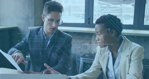 Diverse Coworkers Analyzing Digital Data in Modern Office