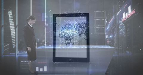 Businesswoman analyzing holographic map in futuristic laboratory