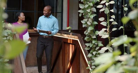 Team Celebration on Office Terrace with High Fives and Smiles