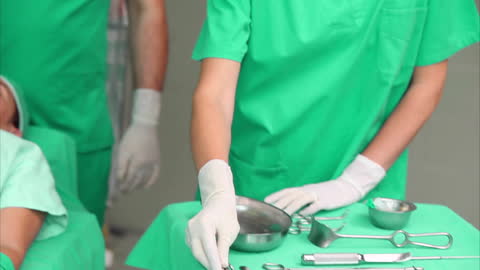 Surgeons Performing Procedure in Operating Room
