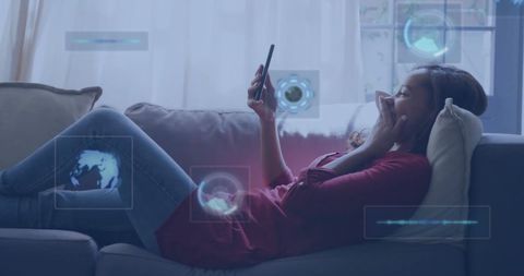 Biracial Woman Relaxing on Sofa Using Smartphone with Digital Graphics