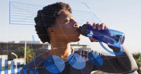 Rooftop athlete drinking from blue sports bottle with fitness analytics overlay