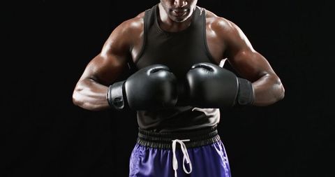 Boxer Preparing for Match Showcasing Strength and Determination