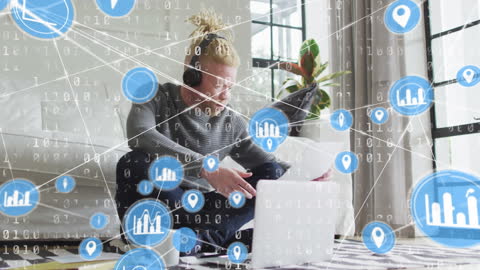 Albino Man Interacts with Virtual Network Interface Using Laptop