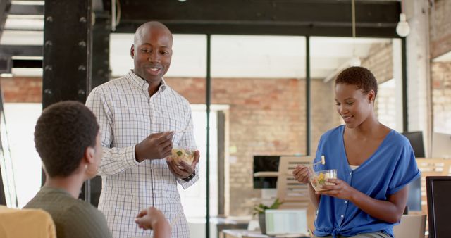 Diverse professionals enjoying lunch break in modern office - Download Free Stock Images Pikwizard.com