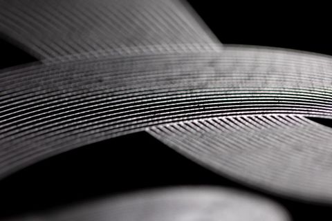 Abstract Close-up of Intricate Curved Lines on Dark Background