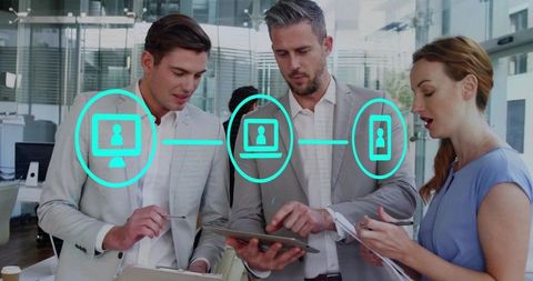 Business Team Collaborating Over Tablet With Digital Network Overlay in Modern Office