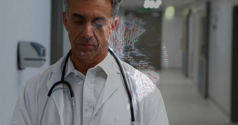 Physician studying holographic 3d medical visualization in hospital corridor