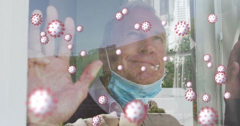 Senior Man with Mask Viewing Coronavirus Graphic through Window