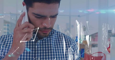 Businessman Engaged in Phone Conversation with Digital Network Overlay