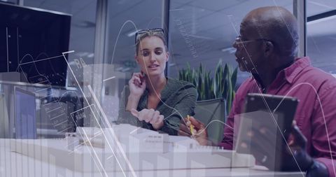 Colleagues Analyzing Data at Modern Office Swapping Ideas