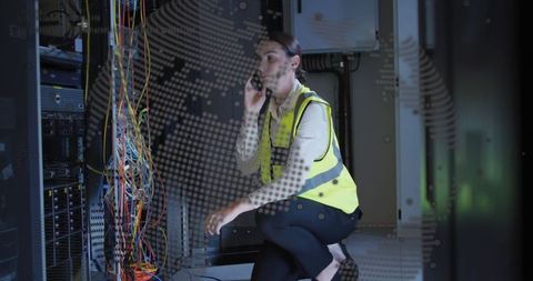 Female Technician Managing Network Cables in Data Center