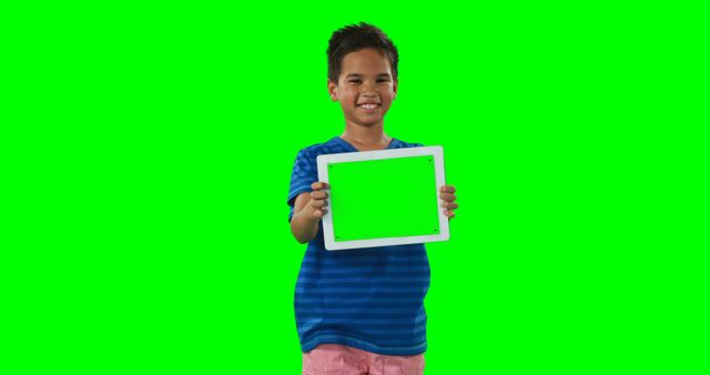 Smiling Boy Holding Tablet with Green Screen - Download Free Stock Images Pikwizard.com