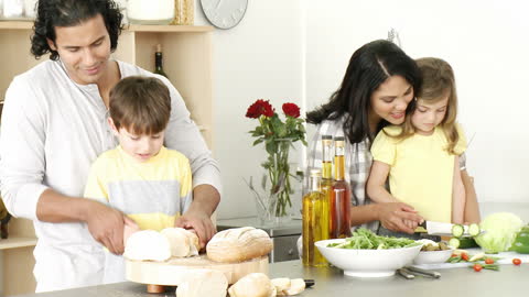 Happy Family Enjoying Meal Preparation in Modern Kitchen