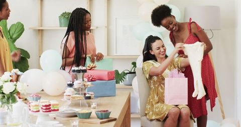 Joyful Friends Celebrating Special Occasion in Stylish Home Setting