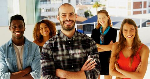 Diverse Young Adults Smiling Confidently in Urban Setting