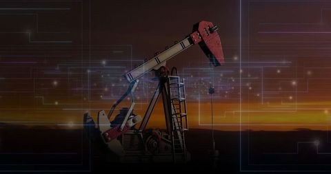Oil Pumpjack with Digital Circuit Overlay at Sunset