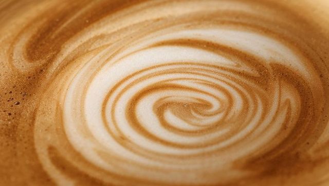 Creamy caramel swirl in latte with foam texture
