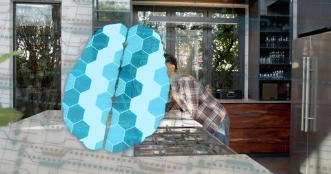 Man leaning over kitchen island studying blue hexagon brain overlay in modern home