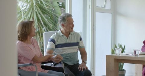 Senior Couple Enjoying Conversation at Home